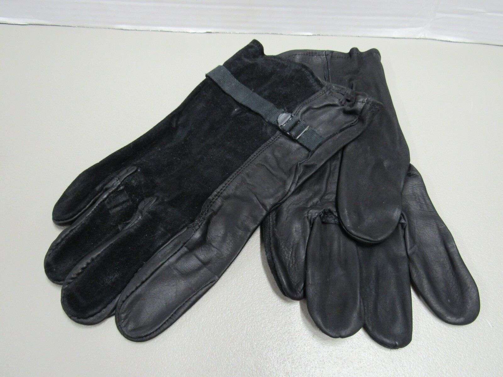 USGI leather gloves.