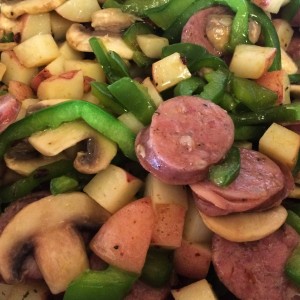 Sausage, peppers and mushrooms on garlic rosemary potatos