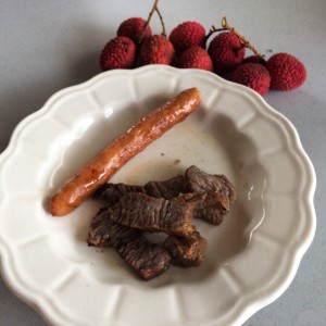 Afternoon snack - leftover grilled steak, smoked sausage and fresh lychee