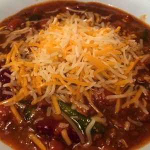 Dinner... Chili with peppers and cheese.