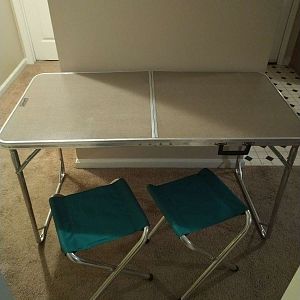 Folding table with two stools